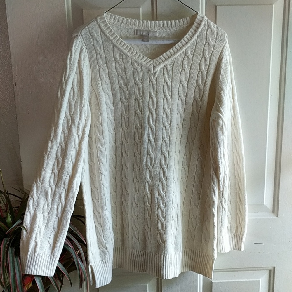 Woman within cable knit sweater